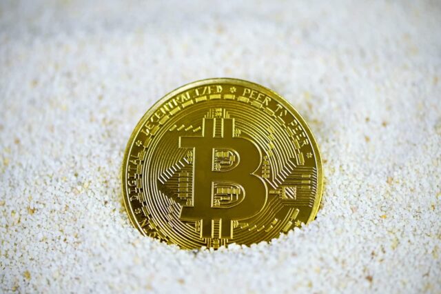 gold and black round coin