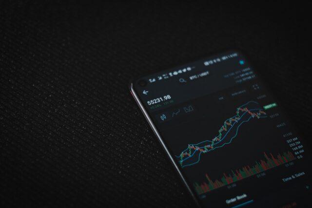 black android smartphone on black textile