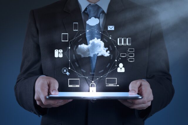 A person holding a tablet Description automatically generated