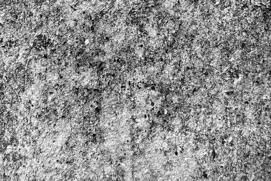 a black and white photo of a concrete wall